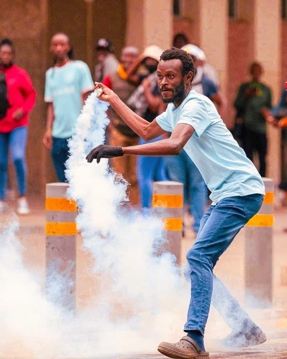 A demonstratior returning a teargas during June 25th Demos 2025 A demonstratior returning a teargas during June 25th Demos 2025
