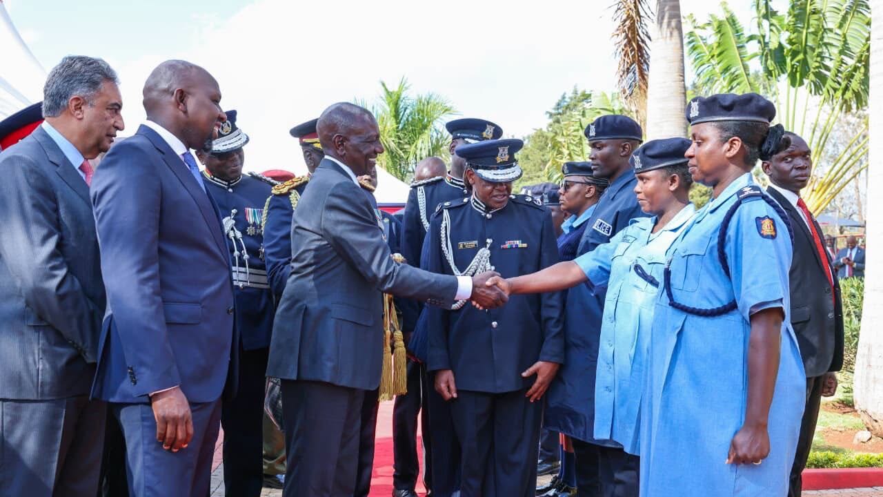 President Ruto alongside Police women dressed in new uniforms President Ruto alongside Police women dressed in new uniforms