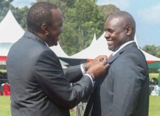 I fought Ebola in Liberia; It is not a Death Sentence. Dr. Komu Mutunga being awarded by President Uhuru Kenyatta